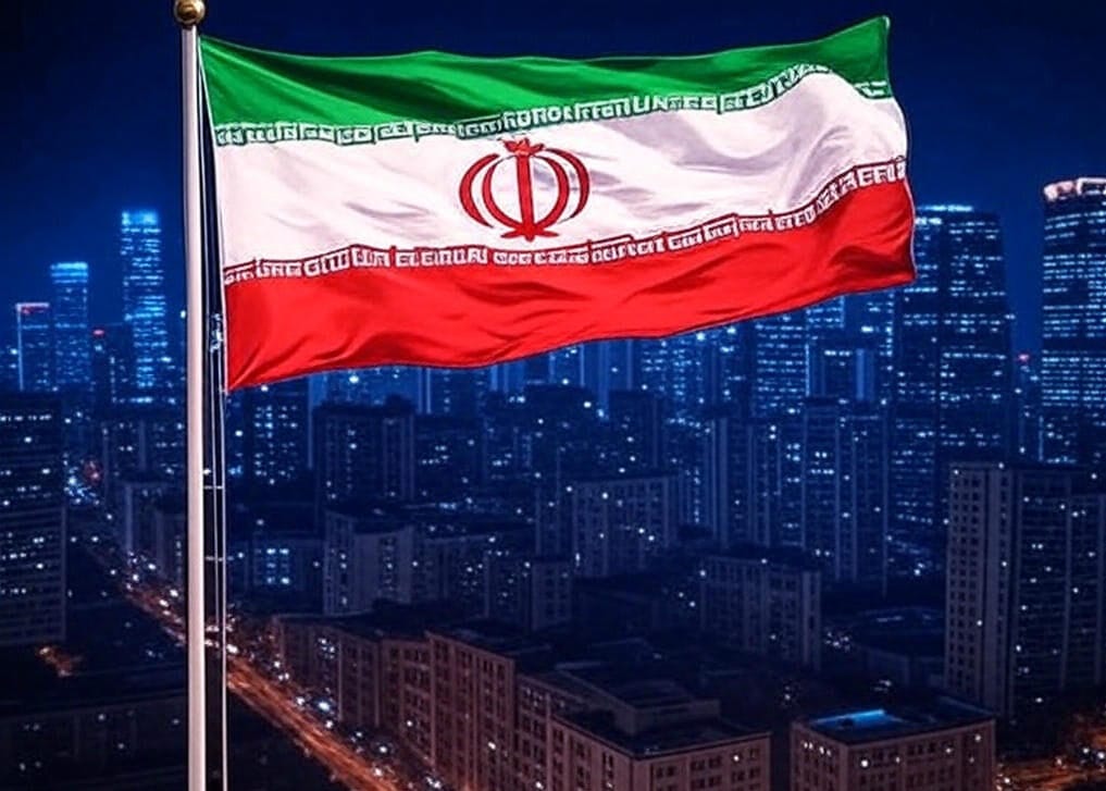 A vibrant cityscape at dusk with modern skyscrapers in the background, featuring two flagpoles side by side. One flagpole displays the Iranian flag with green, white, and red stripes and a red emblem, while the other shows the Chinese flag with a red background and yellow stars. Traditional architecture with curved roofs is visible in the foreground.