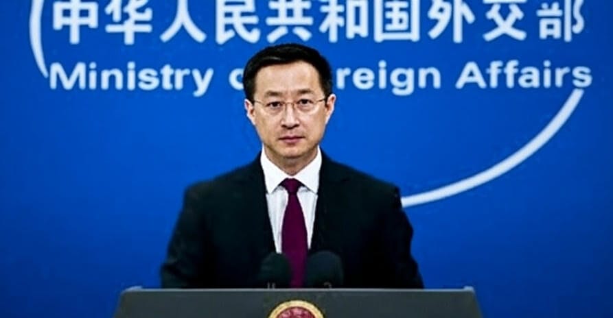A Chinese official in a dark suit and purple tie stands at a podium with the emblem of the People's Republic of China, delivering a statement against a blue backdrop featuring the logo of the Ministry of Foreign Affairs. The setting, captured on June 22, 2025, at 08:43 PM PKT, reflects China's diplomatic response to the Israel-Iran conflict.