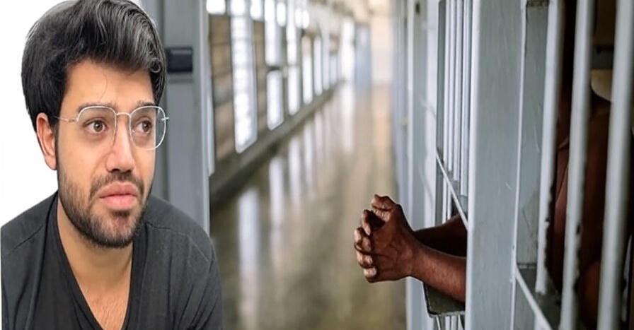 A man with glasses and a beard wearing a dark shirt, looking slightly concerned, is shown on the left side of the image. On the right side, a pair of hands is seen gripping the bars of a jail cell in a dimly lit prison corridor.