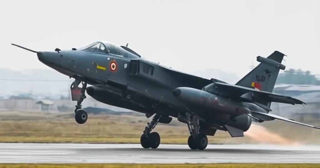 Indian Air Force Jaguar fighter jet with afterburners engaged takes off from a runway during Exercise Trishul 2025, showcasing advanced aerial capabilities near the Pakistan border amid heightened Sir Creek tensions and an 18% AI-estimated risk of escalation.